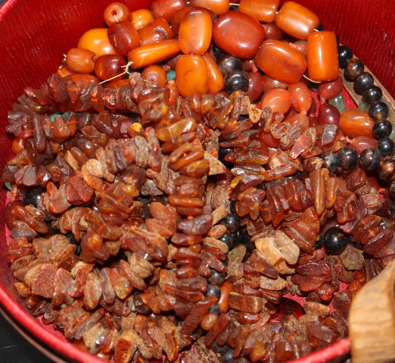 A single strand amber bead necklace, gross 53 grams and other necklaces including amber and hardstone.